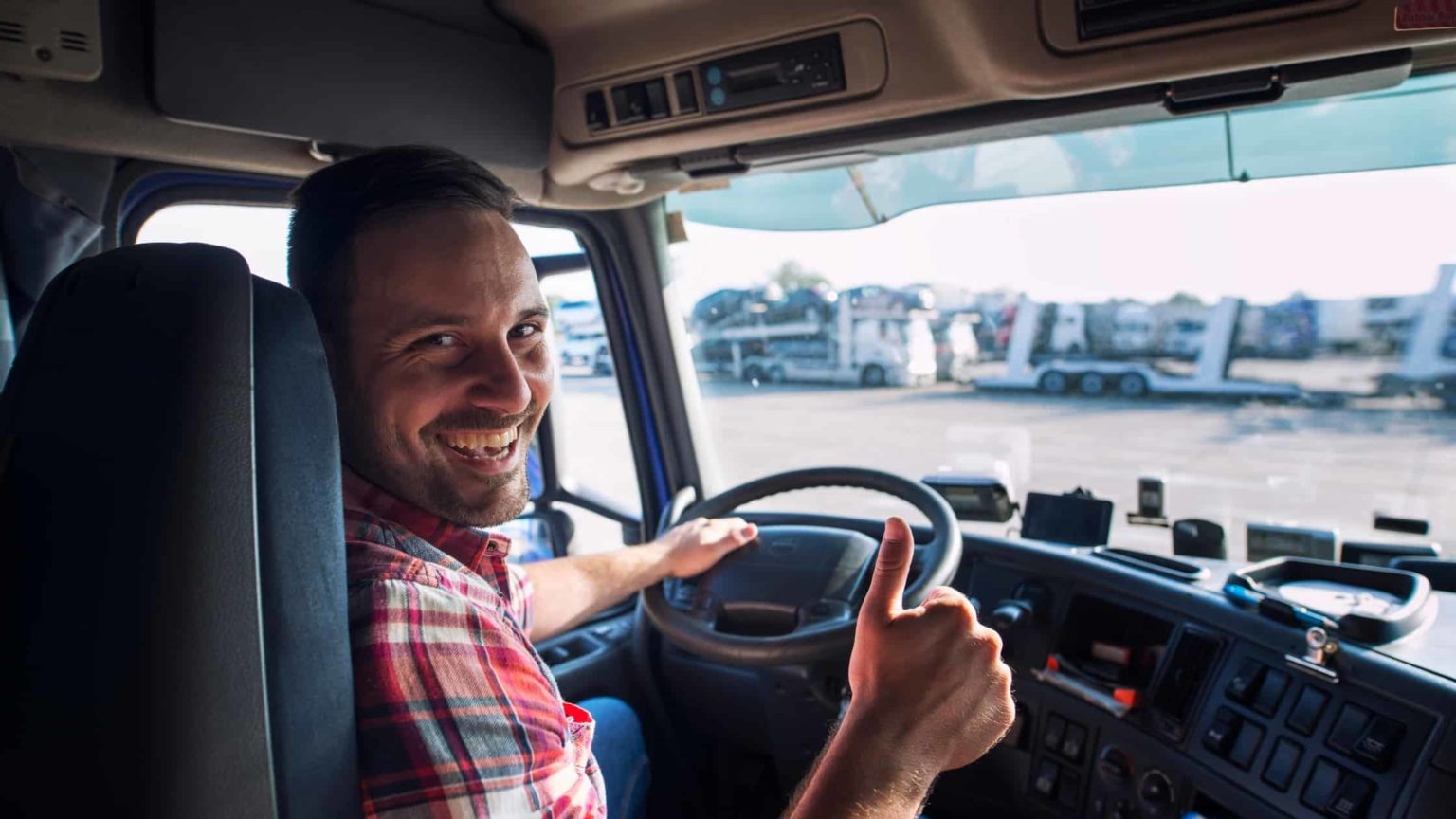 A truck driving on a scenic American highway